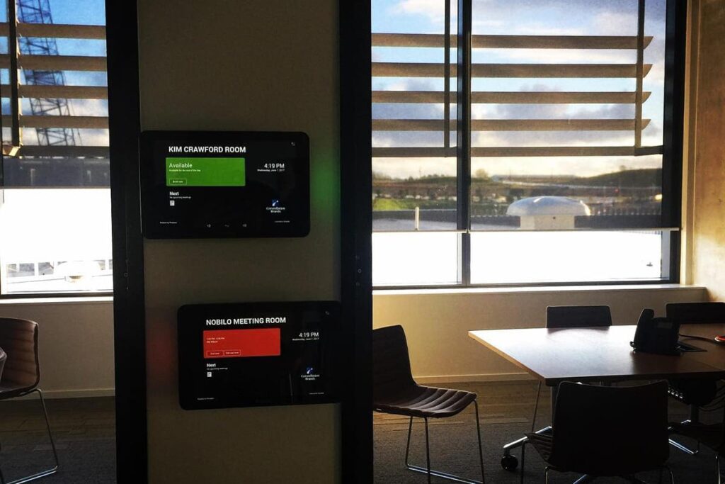 Touchscreen room booking panel outside a meeting room