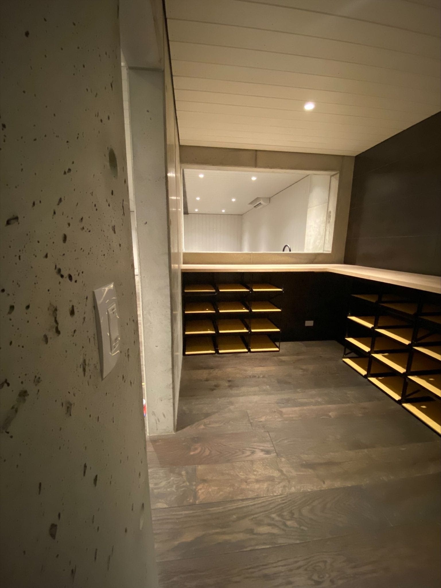 Walk in closet with drawers installed with strip lights and control4 wall panel control installed by Safe n Sound.