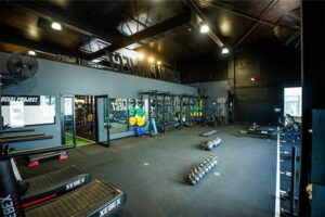 The Social Project Porirua lifestyle club gym interior with integrated AV and audio systems